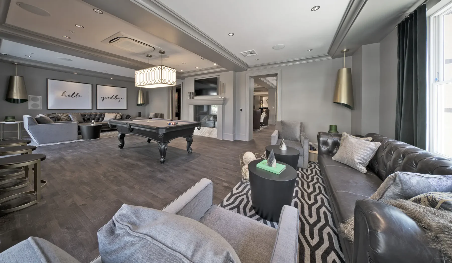 Clubhouse with lounge seating, pool table, and tv
