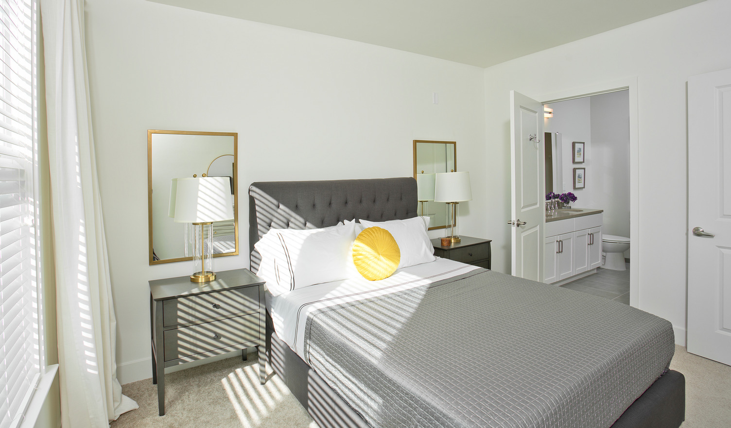 Carpeted bedroom with large window