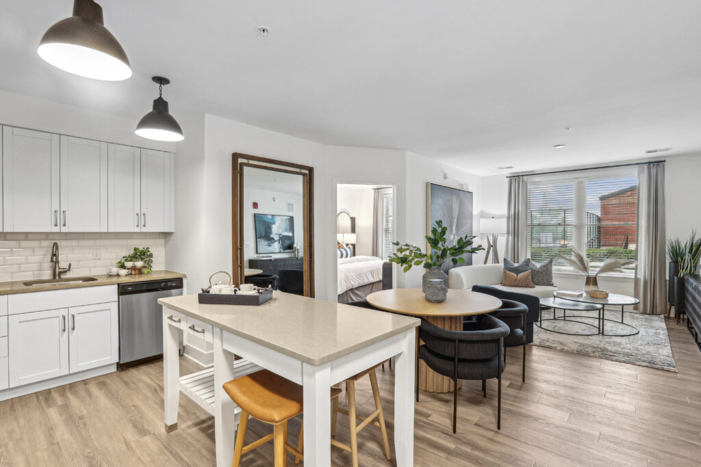 Open concept kitchen and living room with large windows
