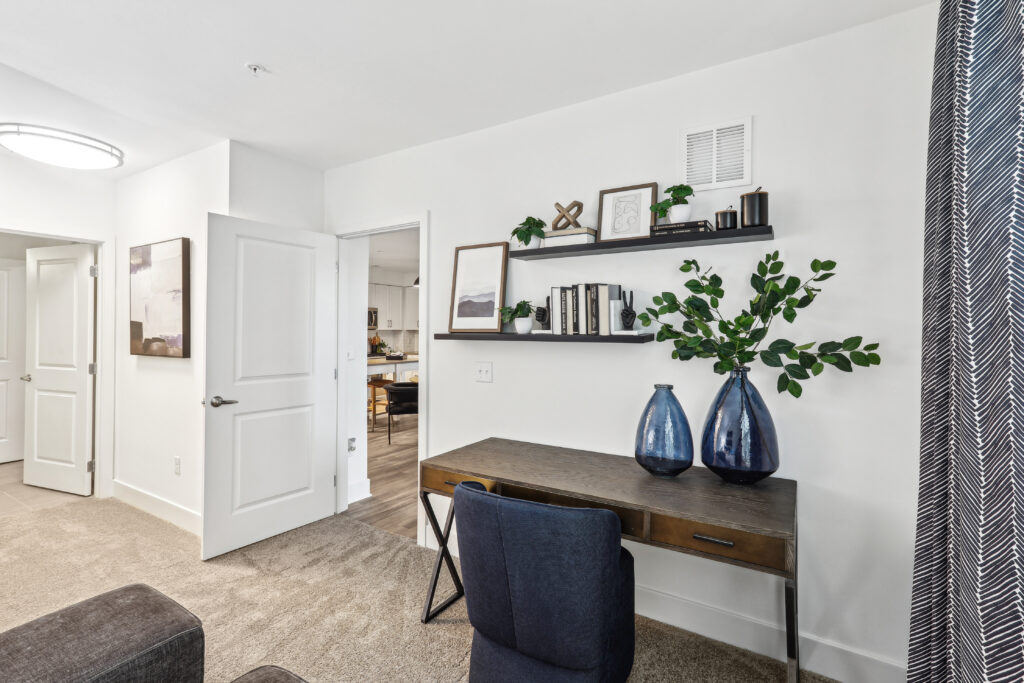Carpeted bedroom with deck and shelves